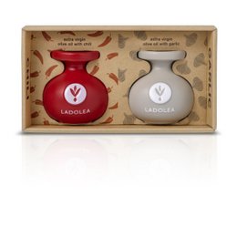 Extra virgin olive oil with chili and garlic, packaged in a carton with two bottles - one red and one white. The product is part of the Olive Oils category.
