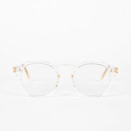 Clear, acetate-framed eyeglasses with a subtle gold accent. Designed for blue light blocking.