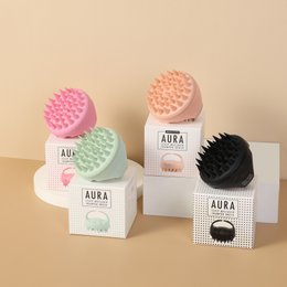 Scalp massager brush with silicone bristles, round dome shape, available in pink, mint, black, nude colors for head massage and washing.