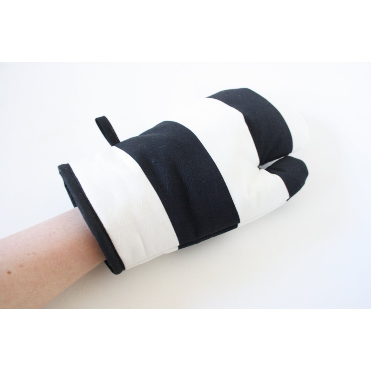 White and black striped oven gloves
