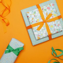 Colorful wrapping paper turquoise with terrazzo pattern, children pack gifts for children's birthday, for school or at birth