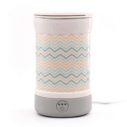  This electric wax warmer features a Scandinavian-inspired chevron pattern in soft pastel colors. It has a compact, cylindrical design and is suitable for use with wax melts or essential oils.