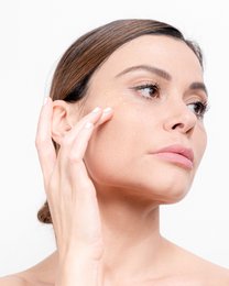 Cream product for reducing wrinkles, with a smooth, creamy texture and a simple, minimalist packaging design.