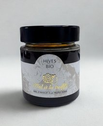 A gourmet honey product with truffles. The honey has a rich, earthy flavor from the addition of truffles.