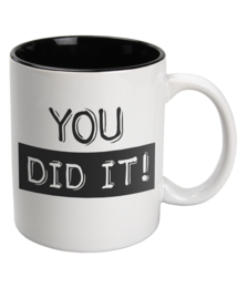 A white ceramic mug with the text "YOU DID IT!" printed in black. The mug has a simple, minimalist design that would make a great gift for someone who has accomplished a goal or achieved something significant.