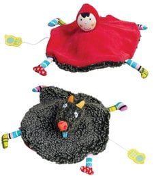 Soft, plush musical toy in the shape of a wolf with a red hooded cape. Textured black wolf-like body with colorful accents and details.