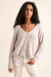 Soft, cozy V-neck cardigan in a variety of neutral colors. Made from high-quality materials for a comfortable, stylish look.