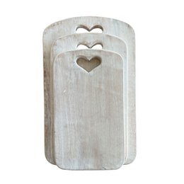 White wooden chopping board with heart-shaped cutouts, suitable for serving plates.