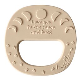"Moon-shaped teething rattle with 4 different color variants, designed for babies to soothe their gums during the teething process."
The product is a moon-shaped teething rattle available in 4 different color variants - Iced Coffee, Mermaid, Rosewood, and Sienna. The rattle is designed to help soothe a baby's gums during the teething process. The moon shape and textured surface provide a comfortable and engaging experience for the baby.