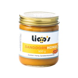 Sea buckthorn honey in a glass jar with a gold lid. The honey has a rich, golden color and is labeled "Sanddorn Honig" which means "Sea Buckthorn Honey" in German.