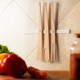 Wooden spatulas with a modern, minimalist design. Features a magnetic strip for easy storage and a lifted design to prevent counter mess. Suitable for a variety of cooking and serving tasks.