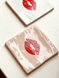  Peach-colored poster with red heart shapes, suitable for decorative or romantic purposes.