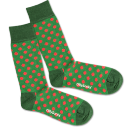 Green socks with red polka dots, suitable for casual or formal wear.
