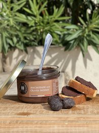Savory anchovy spread with black olives, perfect for crackers or bread. Rich, salty flavor with a smooth texture.