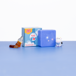 Blue cube-shaped kids' shampoo with cartoon character design, includes bottle and accessories.