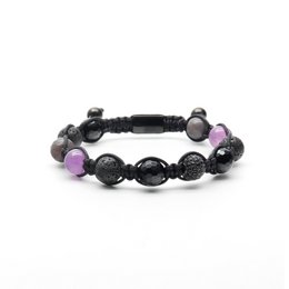 Adjustable beaded bracelet with black and purple beads, featuring a braided cord design.
