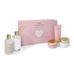 This spa gift set includes a variety of beauty products in soft pink and white packaging, perfect for someone special. The set contains items like lotions, creams, and other pampering essentials.