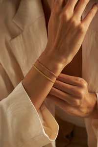 GEWEVEN ARMBAND GOUD
