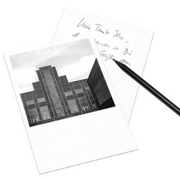 Postcard featuring the Design Center NRW in Essen, Germany. Black and white architectural illustration with handwritten note.