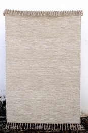 Large, soft, and comfortable Portuguese Amélia area rug available in beige, off-white, and camel colors.