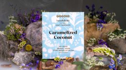 Caramelized coconut chocolate bar, 51% dark chocolate, blue packaging with white botanical pattern design, premium artisan confection.