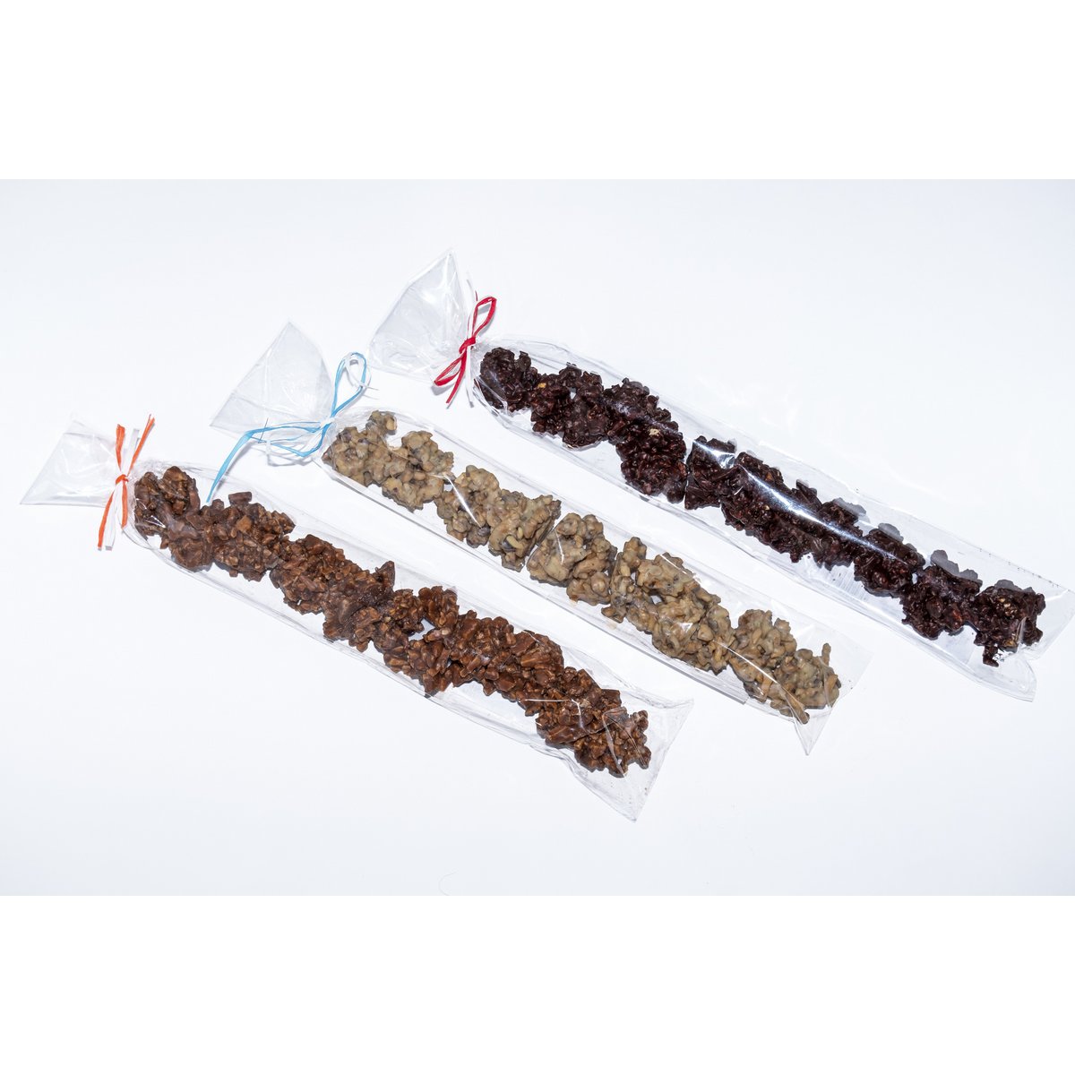 ØKOLOGISK Chokolade Crunchy ROCKS med karameliserede mandler og hasselnødder og citrusfrugter 100g. (Kasse med 12 forskellige enheder)