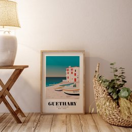 A framed wall art print featuring a coastal landscape with a lighthouse and buildings. The print is titled "Guethary" and is available in A3 and A2 sizes.