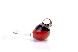 A decorative glass bird figurine in black and red colors. The bird has a rounded, egg-shaped body and a small beak. It appears to be made of glass and has a glossy, reflective finish.