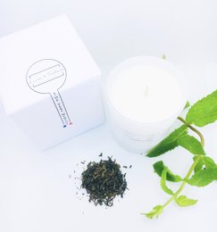 Mint green tea cotton wick candle, a scented candle with a natural cotton wick and a fresh, herbal aroma.