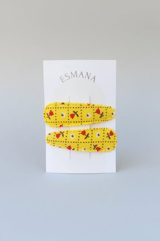 Moschettone da bambino giallo con fiorellini