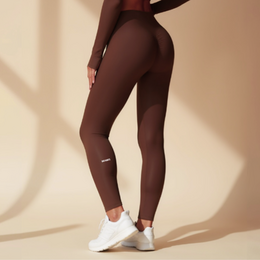 High-waist leggings in a rich brown color, designed for fitness activities. Made of a stretchy, breathable fabric that provides support and comfort.
