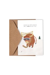 A festive Christmas card featuring a whimsical illustration of a bear in a winter landscape. The card has a warm, earthy color palette and a simple, handwritten-style message.