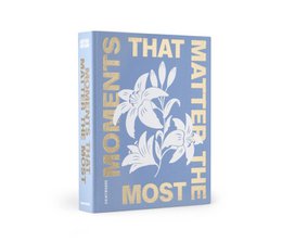  A beige photo album with the text "Moments that matter the most" and a floral design in white.
