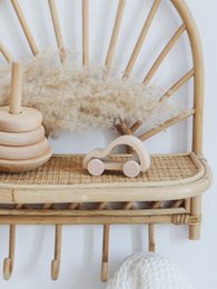Wooden minimalist car with orange circles, a simple and modern toy car design.