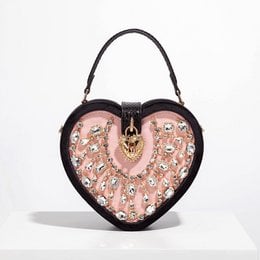 Heart-shaped velour evening bag in black or red, featuring a diamond-patterned design and a decorative heart-shaped clasp.