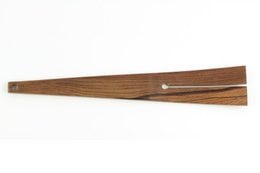 Wooden cooking shovel with a central slot, made of natural wood material, suitable for kitchen use.