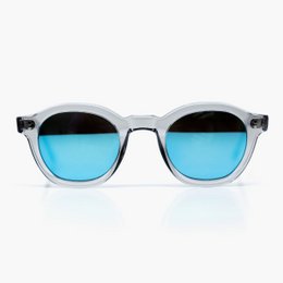 Round, retro-style sunglasses with a translucent blue-gray frame and blue-tinted lenses.