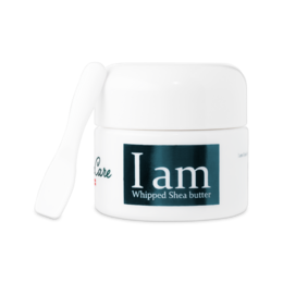 Whipped shea butter cream in a white jar with the text "I am" printed on it.