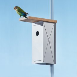 A white and black birdhouse with a perch for birds to rest on. The birdhouse has a simple, modern design and is suitable for outdoor use.