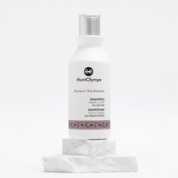 White bottle of Olympus Tilia Blossom Shampoo with silver cap. Shampoo for hair care.