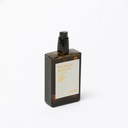  Botanical body oil in a dark glass bottle with a black cap. The label features a simple, minimalist design with the product name and brand name.