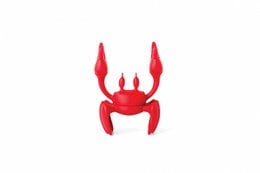 Red crab-shaped dish rack made of plastic material, with a unique and modern design.