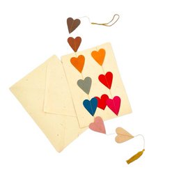 Multicolored handmade greeting cards and garland hearts made from 100% eco-friendly paper, perfect for love and Valentine's Day.