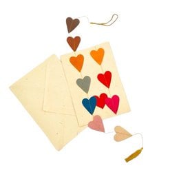 Multicolored handmade greeting cards and garland hearts made from 100% eco-friendly paper, perfect for love and Valentine's Day.
