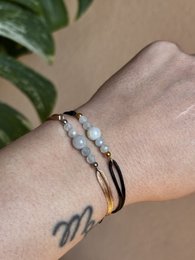 Aquamarine beaded bracelet with gold accents, suitable for March birthdays.