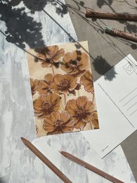 Floral postcard with brown cosmos flowers on a textured background.
