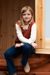 A cozy, knitted orange sweater vest with a V-neck design. The sweater appears to be made of a soft, textured material and is suitable for children's wear.