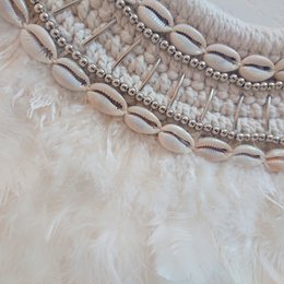 Decorative necklace with feathers and shells
