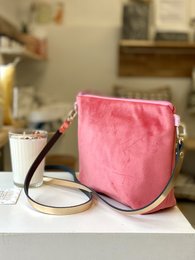 Velvet shoulder bag in rose blush, navy blue, and yellow colors with a detachable strap.