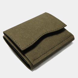  Minimal wallet made of brown paper material with a simple, compact design.